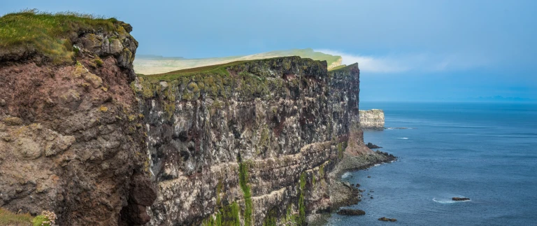 Expedition island und spitzbergen ungezaehmte natur des nordens hanseatic nature von reykjavik nach longyearbyenshutterstock island latrabjarg klippen scaled aspect ratio 1500 630 scaled